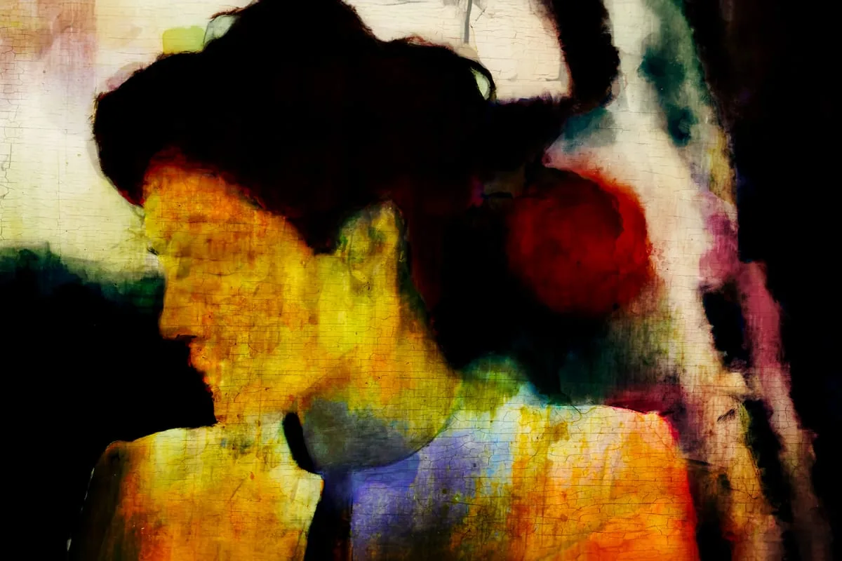 An abstract artwork depicting a woman's silhouette with color and texture